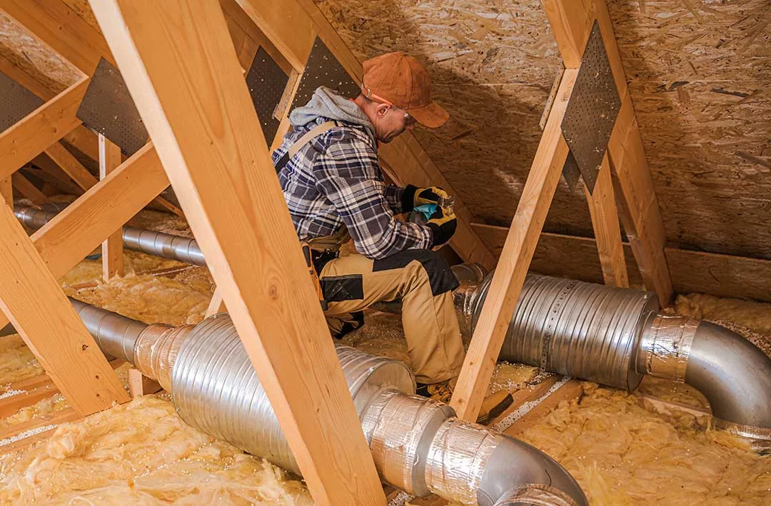 Technician installing insulation in a Los Angeles home